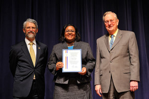 Dr. Cox receiving the Presidential Early Career Award for Scientists and Engineers (PECASE) from White House OSTP Director John Holdren and former NSF Director, Arden Bement, Jan. 13, 2010 (Photo courtesy of the White House)